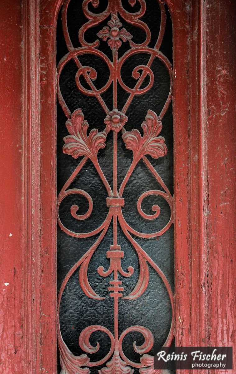 Old metal ornaments in wooden doors