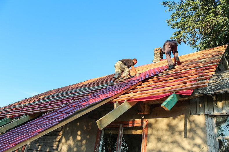 Sliding metal roof plate a top to the roof