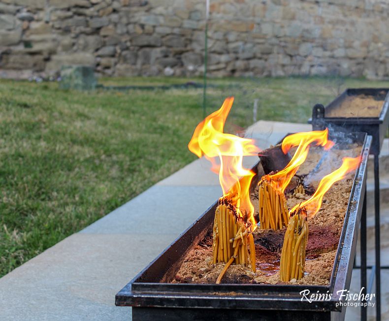 Burning prayers candles at Samtavro monastery