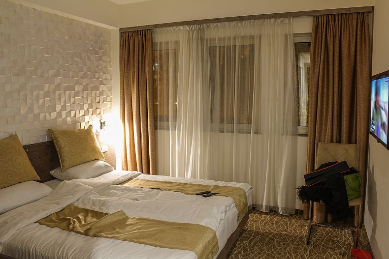 King size bed and flat screen TV at Park hotel in Yerevan
