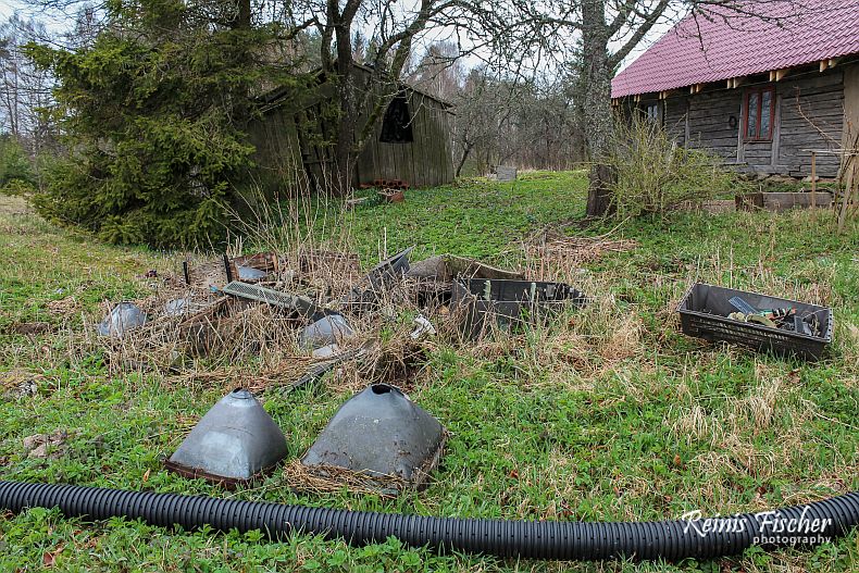 Dump with old TV picture tubes, plastic bottles and cans