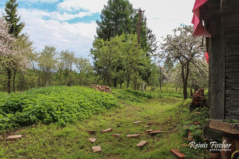 Bricks are stored in a stack near house