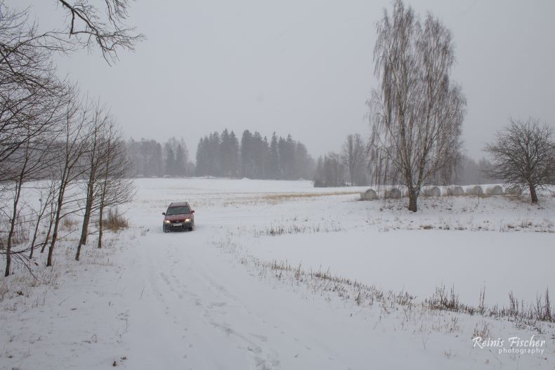Car parked next to the pond