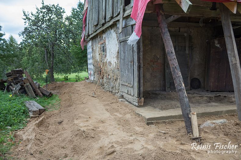 Grading soil around foundation