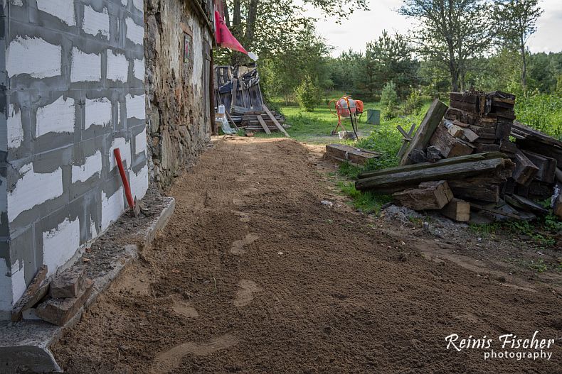 Grading soil around foundation