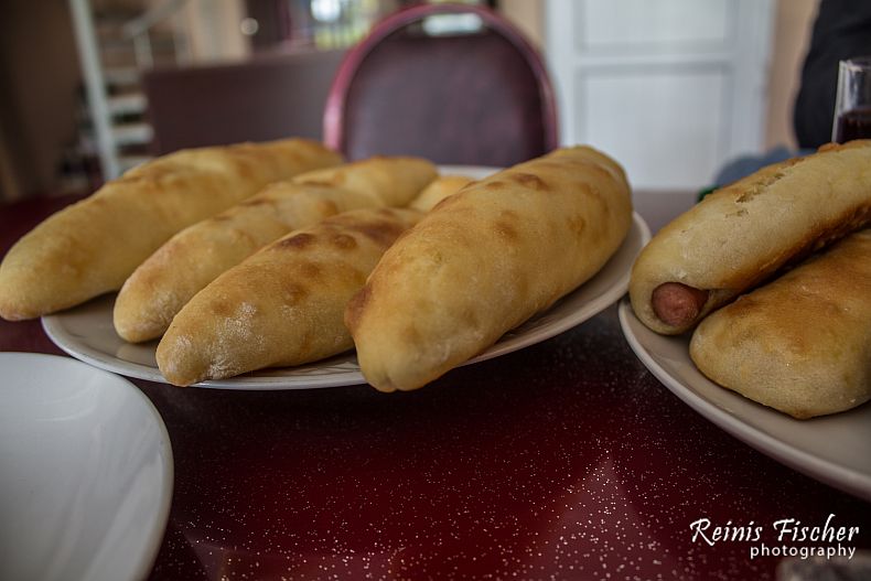 Bakes pies with potato filling and wrapped sausages