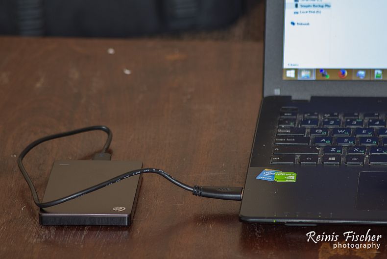 Seagate external portable hard drive connected to laptop